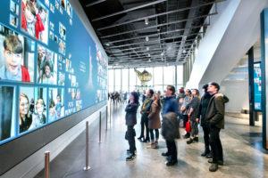 Museumgoers experience the interactive museum av installation.